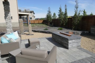Modern great interlocking patio with rectangular fire pit and flame burning