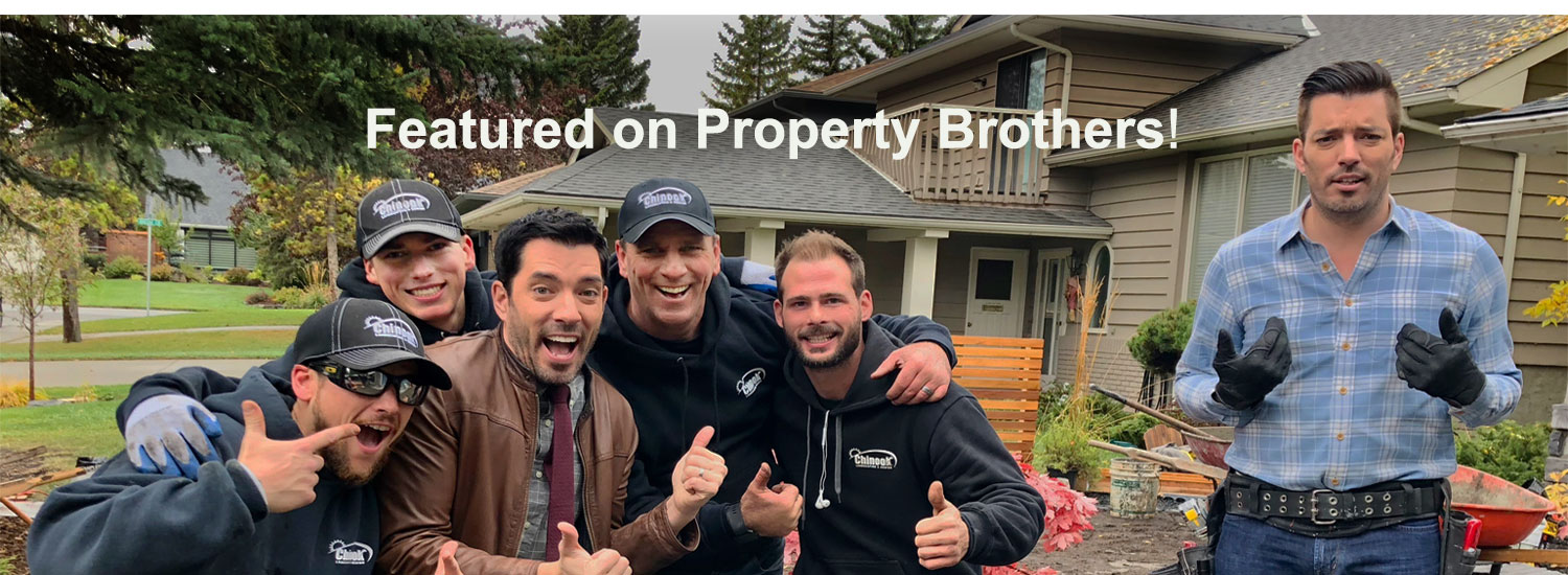 Chinook Landscaping and design employees standing with the Property Brothers